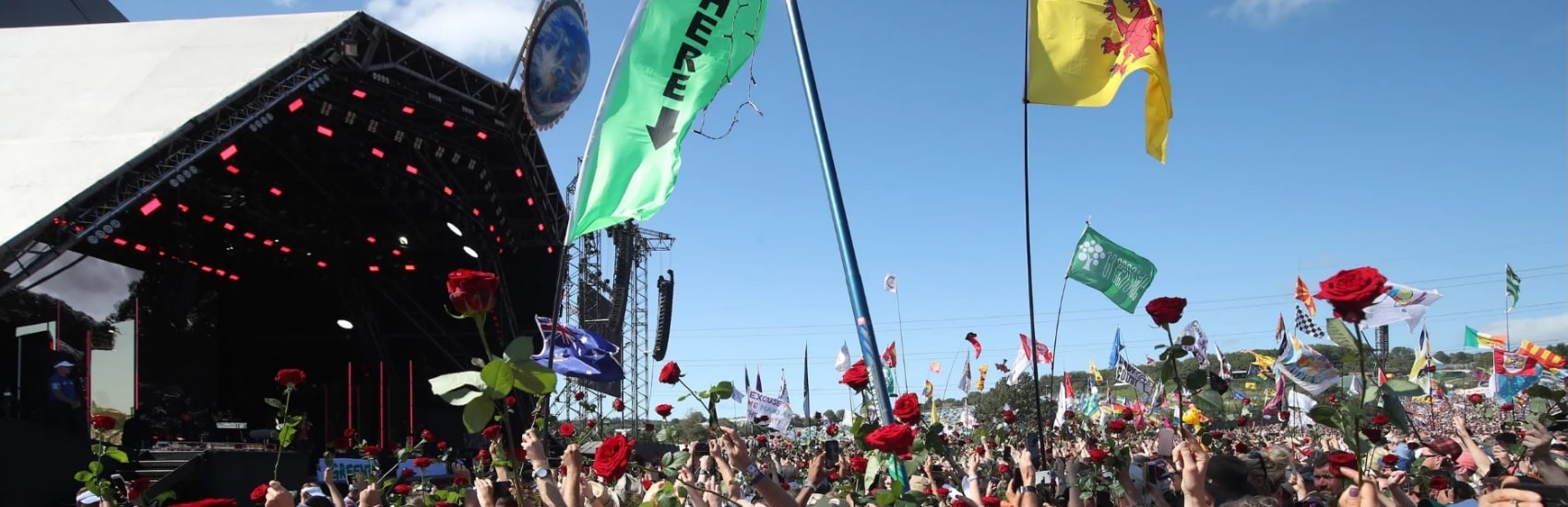 Photo of a crowd of people at Glastonbury in front of the stage