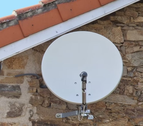 A satellite dish on a wall