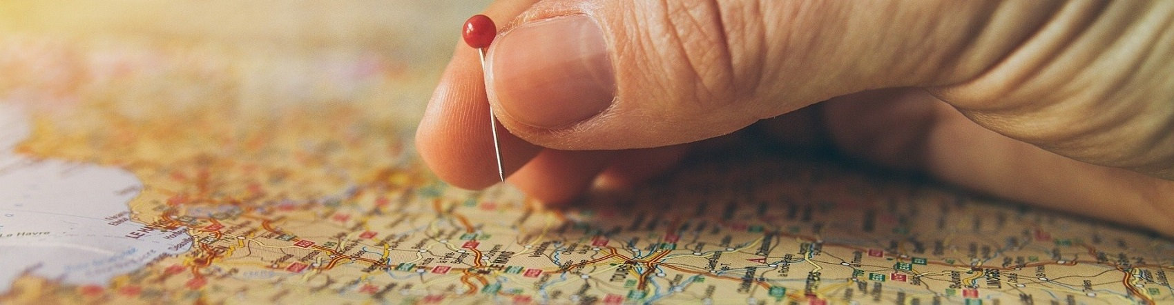A map pin hovering over a map