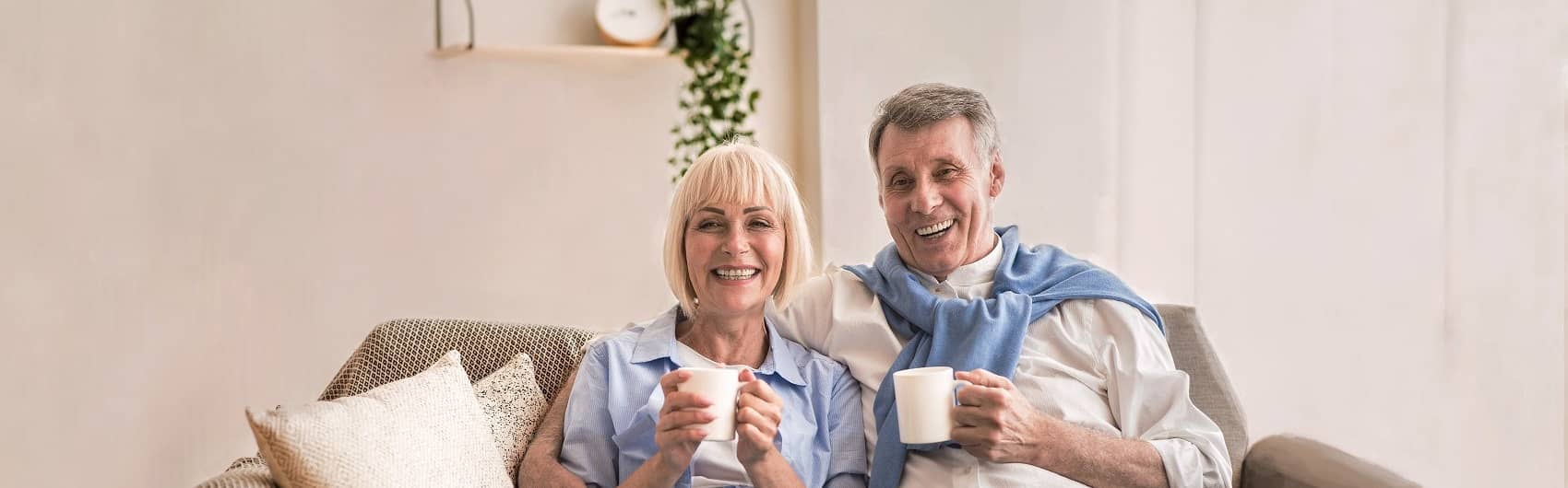 Happy couple sitting on a sofa